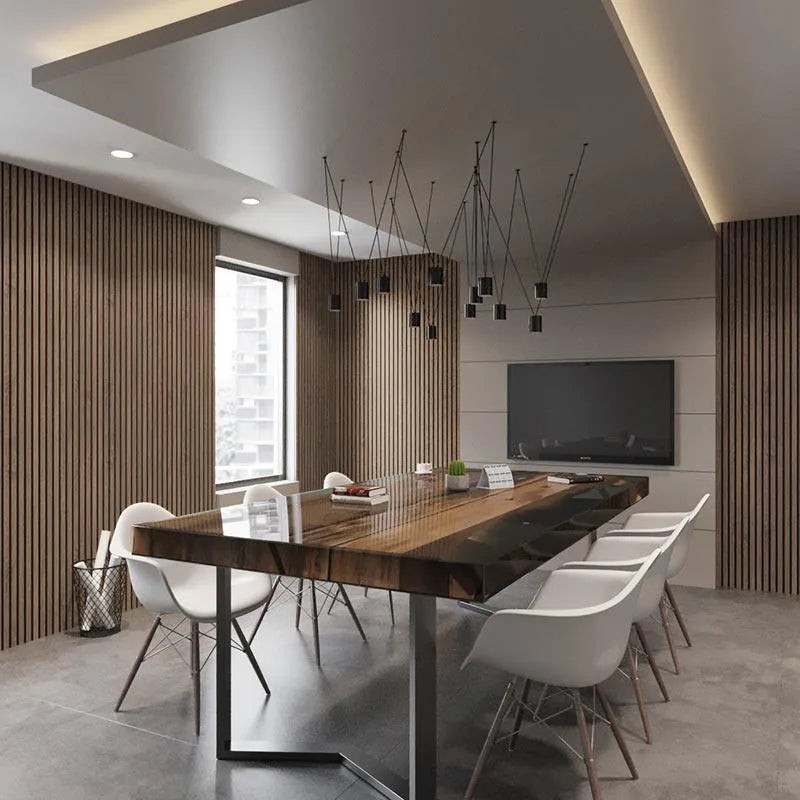 Walnut slat wall panels in a dining room with a long table and pendant lighting.