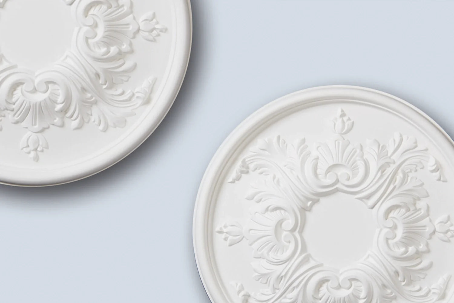 Are ceiling roses old fashioned? Ceiling roses on light blue background