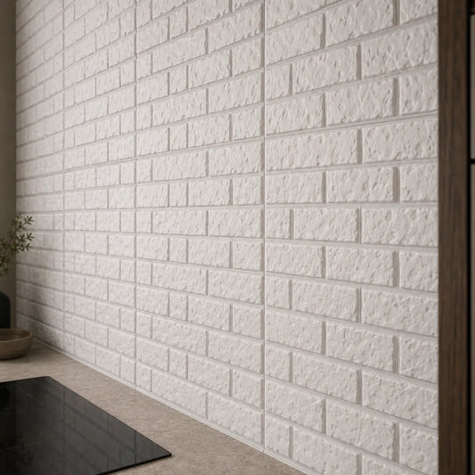 Close-up of textured white 3D brick-effect polystyrene wall panels above a modern kitchen worktop