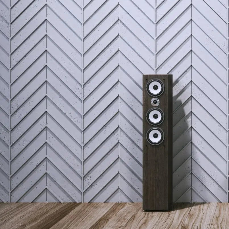 Concrete Cladding HERRINGBONE L REVERS Wall Panels in living room interior with speaker cropped DecorMania.eu