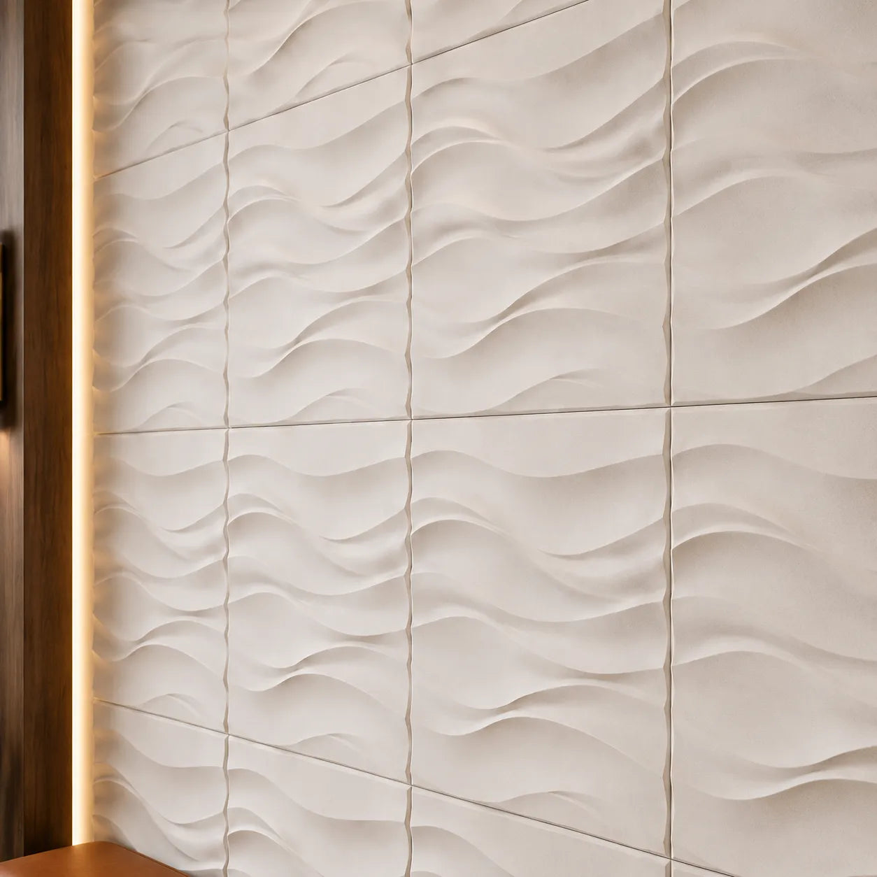Close-up of white Desert Sand gypsum 3D wall panels showing the wave pattern, regular joints and matte texture