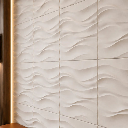 Close-up of white Desert Sand gypsum 3D wall panels showing the wave pattern, regular joints and matte texture