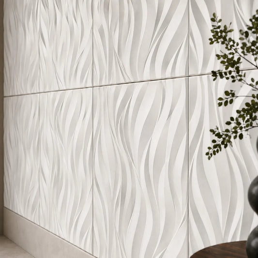 Close-up of white 3D polystyrene wall panels with a sculpted flowing flame pattern
