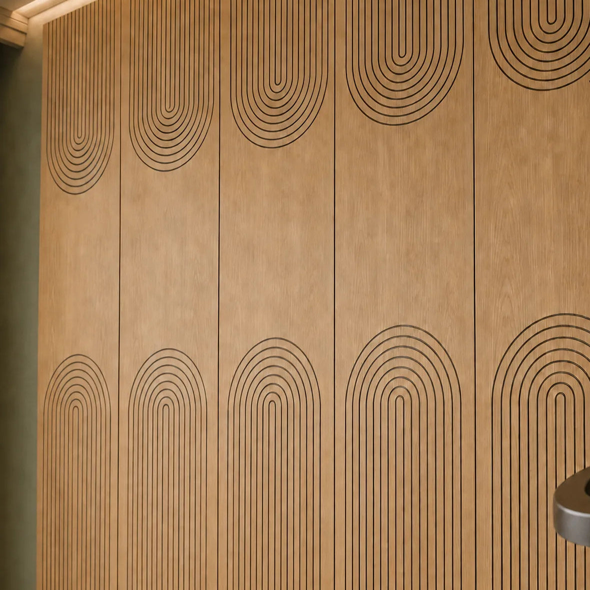 Close-up of oak acoustic wall panels with curved black MDF grooves
