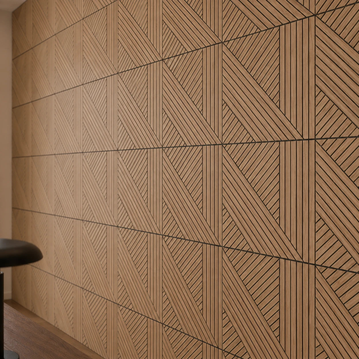 Close-up of GrooveCraft milled acoustic wall panels with oak veneer, black grooves and a geometric diagonal pattern