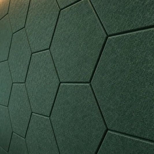 Dark green HEXA 3D PET felt wall panel with a geometric hexagonal shape close up view