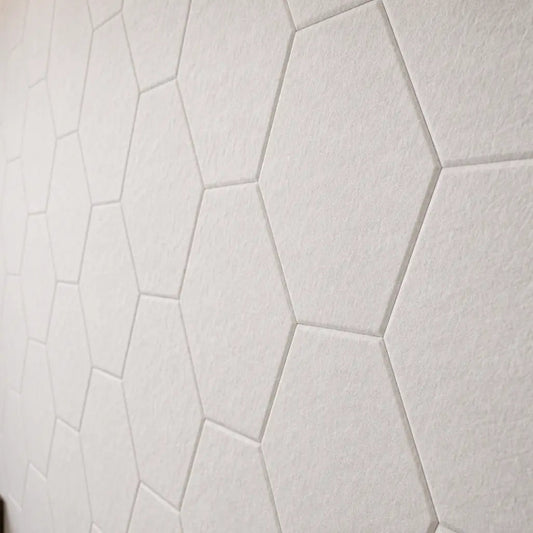 White HEXA 3D felt PET wall panels in an elegant dining room with a dark wooden table, upholstered chairs and modern pendant lighting close up view