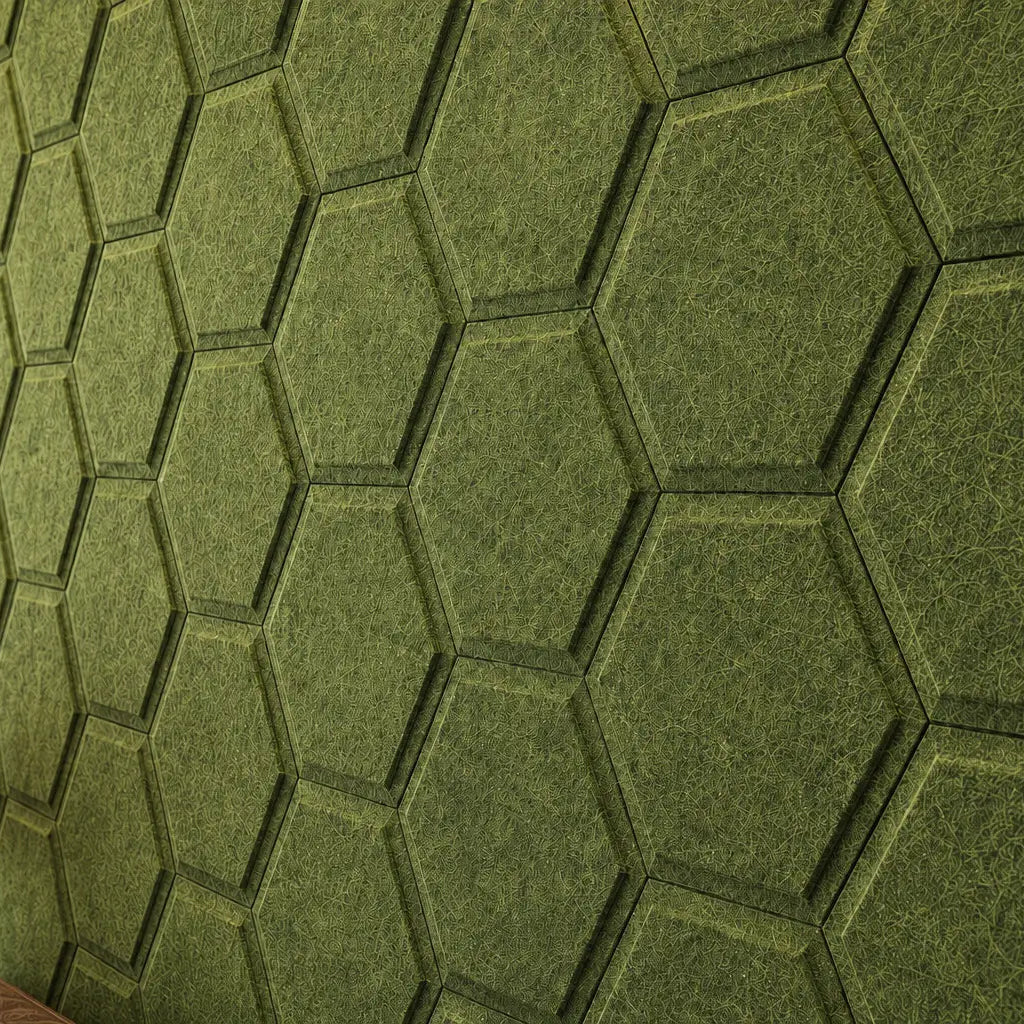 Close-up of olive HEXA BOLD 3D acoustic felt wall panels, showing their raised centres, flat outer edges, seamless joints and detailed felt texture