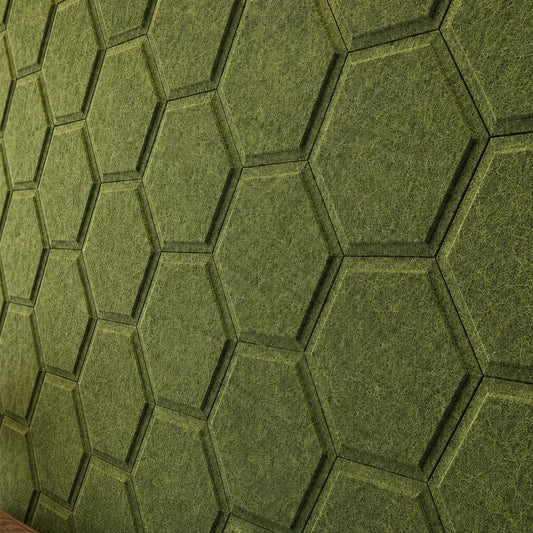 Close-up of olive HEXA BOLD 3D acoustic felt wall panels, showing their raised centres, flat outer edges, seamless joints and detailed felt texture