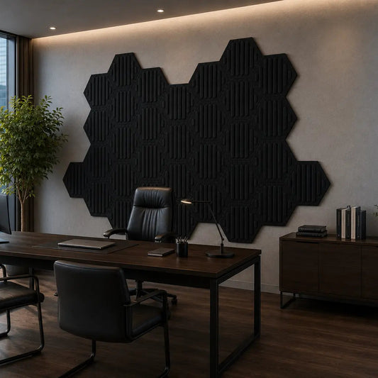 Black HEXA RIFT 3D acoustic felt wall panels shown from a 45-degree angle in a modern high-rise office