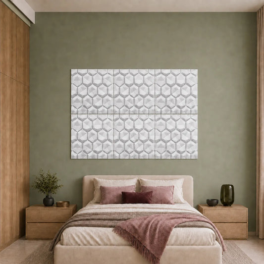 White geometric hexagon polystyrene wall panels displayed above a bed in a modern sage green bedroom