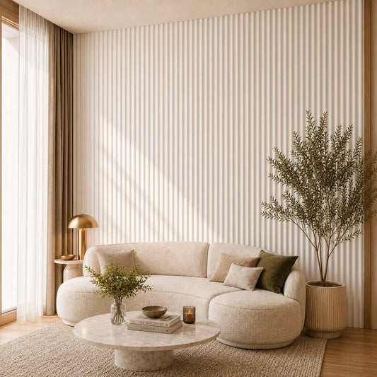 Angled view of a modern cream living room with white matt MDF concave fluted wall panels, a curved sofa and a marble coffee table