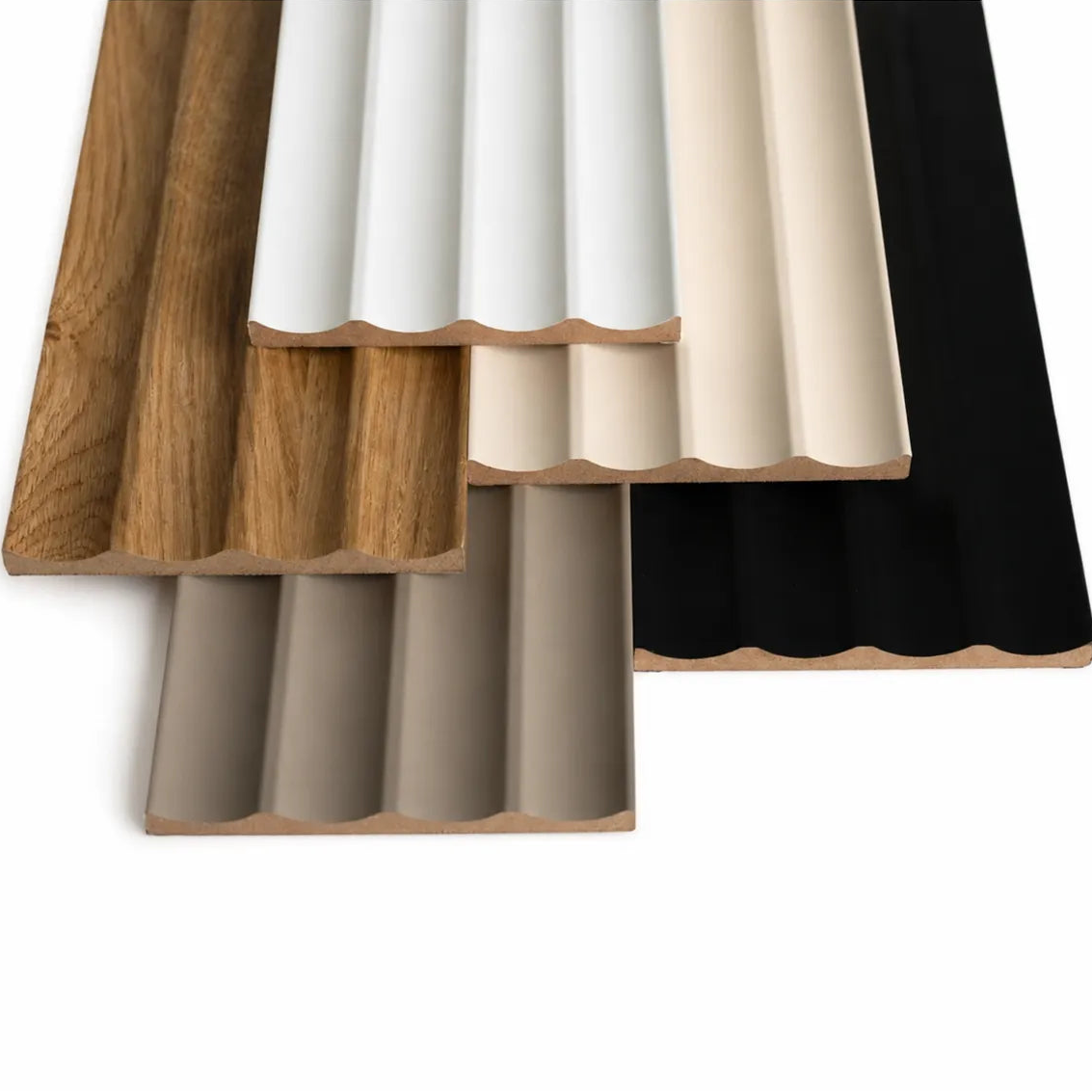 Close-up of five MDF fluted wall panel finishes with curved grooves and exposed MDF edges