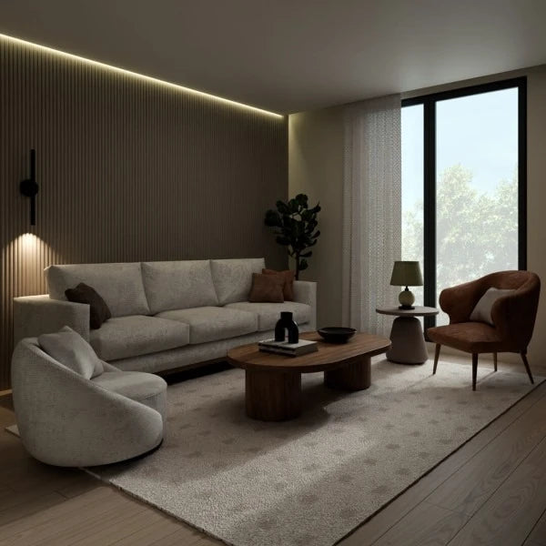 Modern living room with neutral furniture, warm lighting and a full-height cashmere fluted feature wall