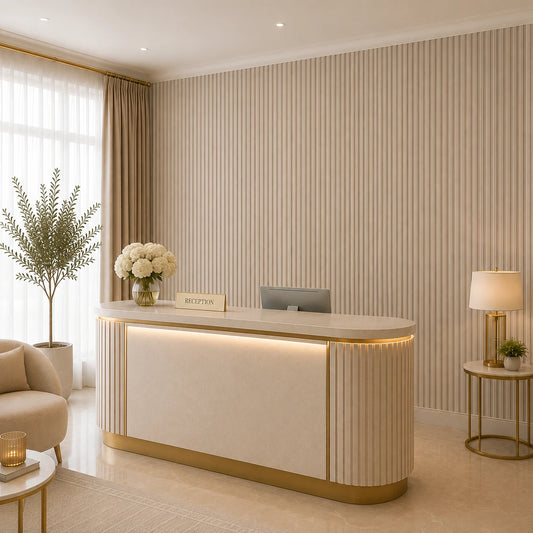 Angled view of a luxurious hotel reception featuring a rounded illuminated desk, cashmere convex wall panels, soft beige furnishings, gold accents, and a bright window