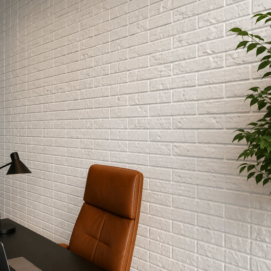 Close-up angled view of white brick-effect 3D polystyrene wall panels, highlighting their staggered layout, aged surface texture, and realistic mortar lines.
