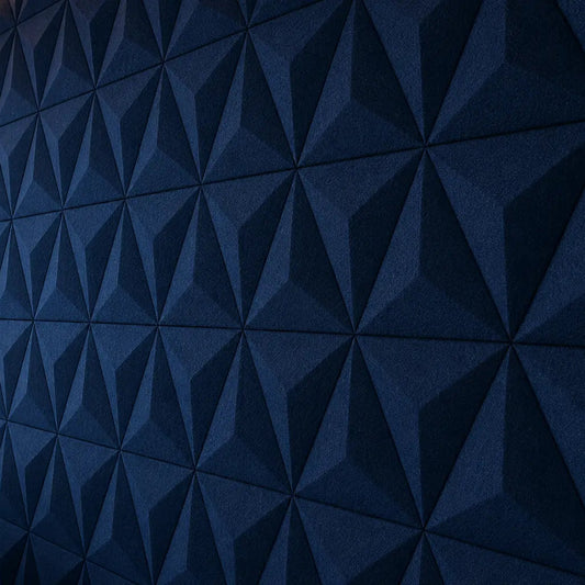 Navy PYRAMID 3D acoustic felt wall panels in a modern call centre office, featuring a sharp geometric relief and textured finish close up view