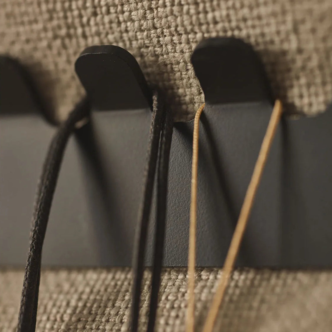 Padded Wall Boards Accessories - Decorative Strip 1 Black closeup on hooks Docormania.eu