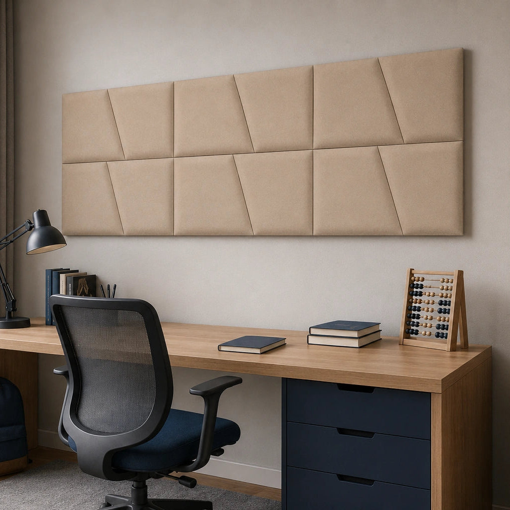 Angled view of a beige modular wall panel arranged in two rows above a home-office desk, showing its regular grid and diagonal pattern