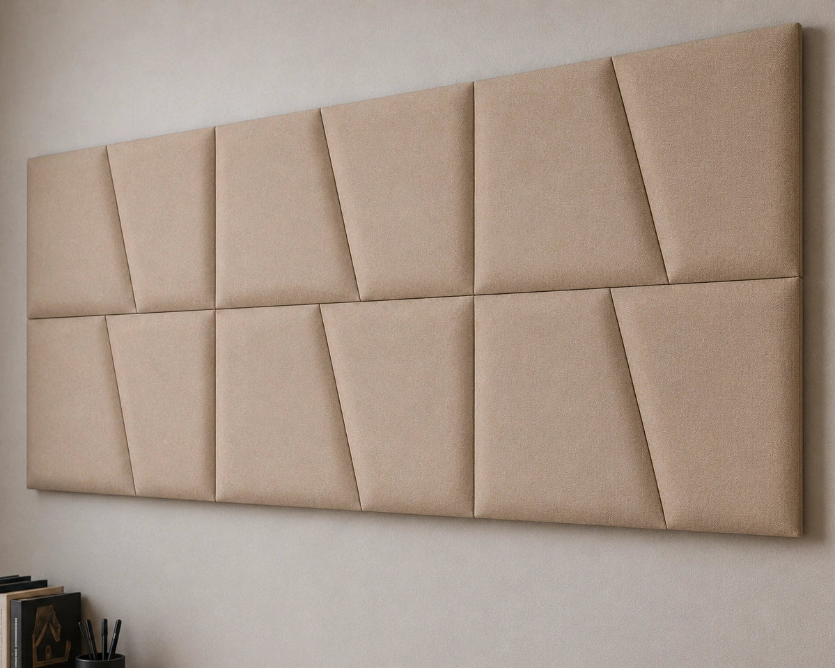 Close-up angled view of beige upholstered wall panels, highlighting the geometric seams, padded relief, precise joints and textured fabric finish