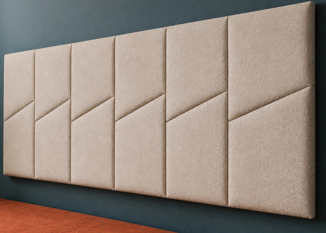 Close-up of six cream padded wall panels, highlighting the textured upholstery, soft relief and diagonal design