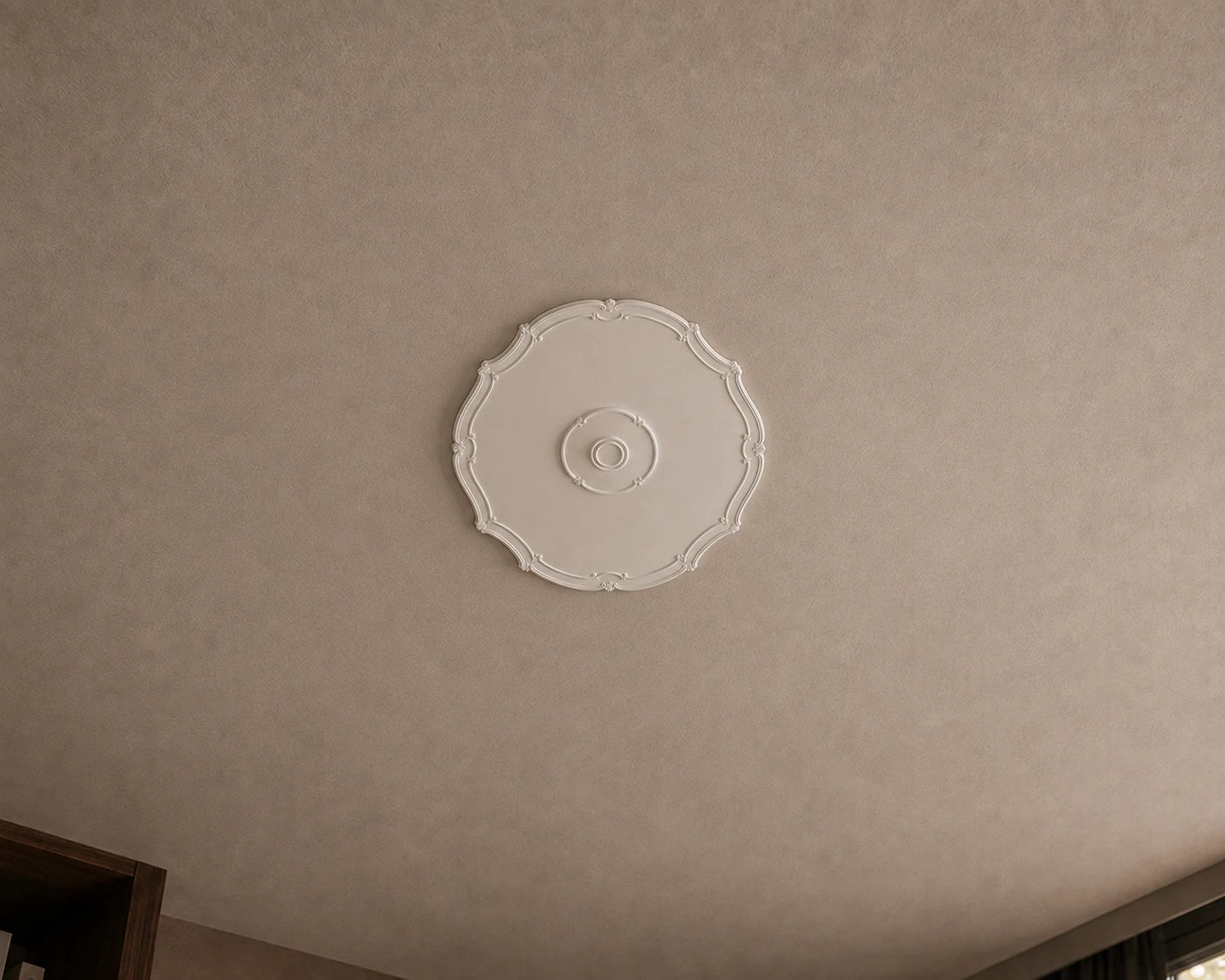 Close-up of the white R16 Arstyl ceiling rose with a smooth centre, delicate curved border and subtle ornamental details