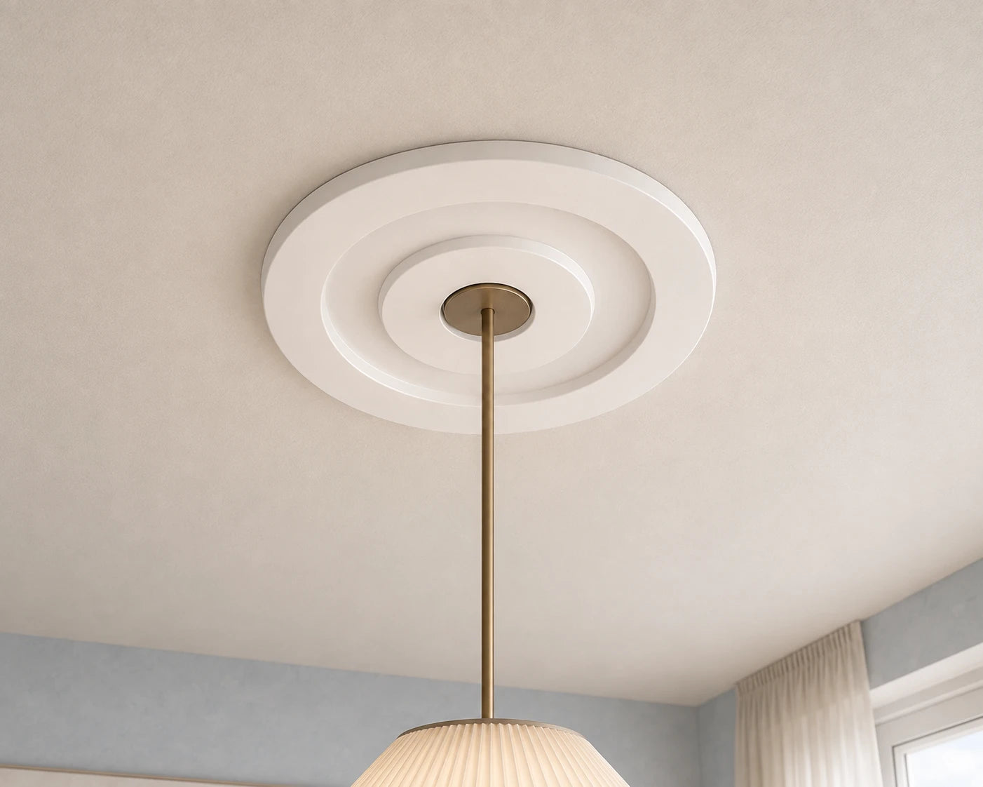 Close-up of the white R61 Arstyl ceiling rose with smooth stepped concentric rings framing a brass pendant light
