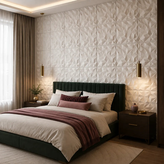 Angled view of a modern bedroom with white geometric 3D gypsum panels covering the feature wall behind a dark green bed, complemented by brass lighting and warm neutral décor