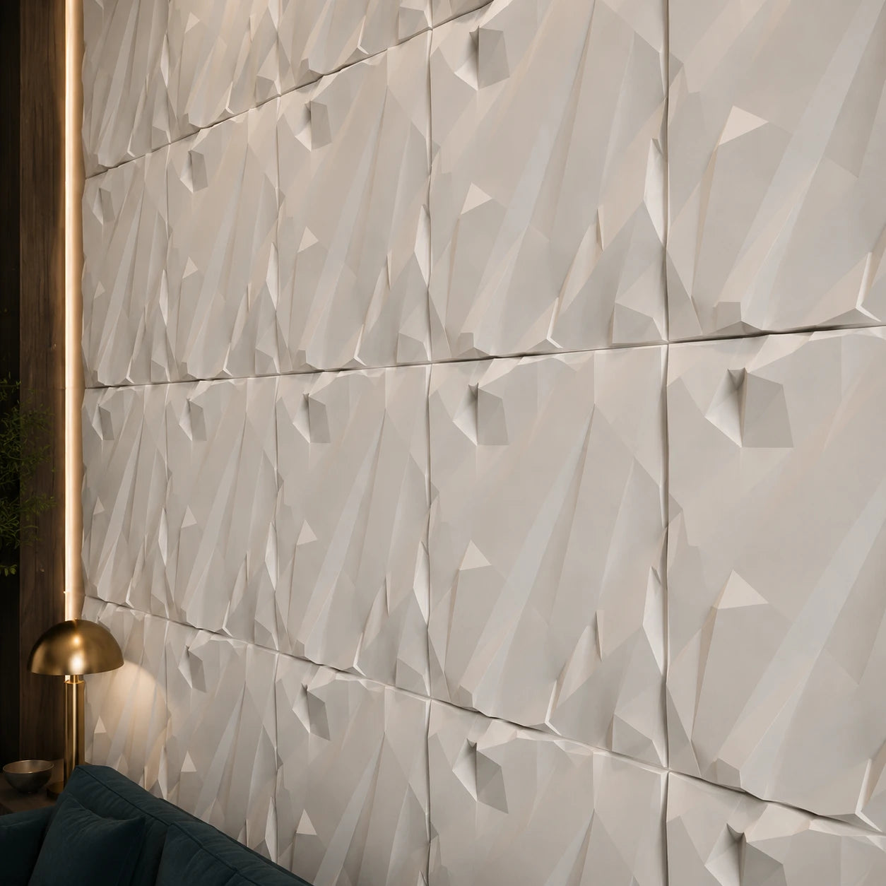 Close-up of white CRUSHED ROCK gypsum 3D wall panels showing their angular relief, aligned joints and matte texture