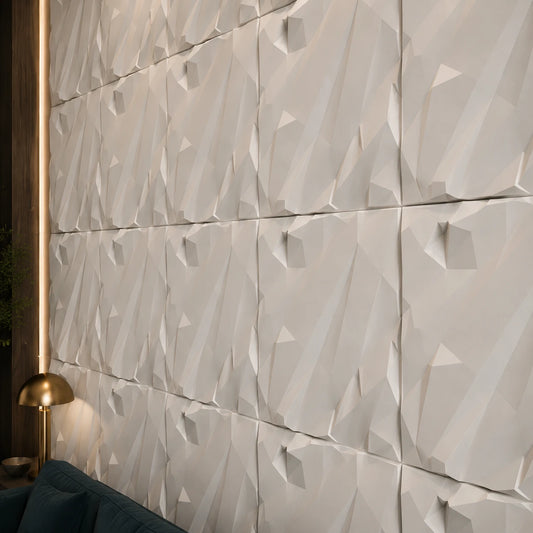 Close-up of white CRUSHED ROCK gypsum 3D wall panels showing their angular relief, aligned joints and matte texture