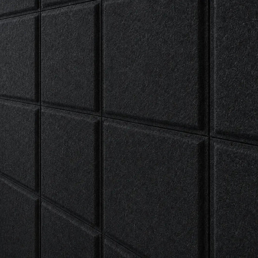 Close-up of black Square Bold 3D acoustic felt panels highlighting their fibrous texture and geometric relief