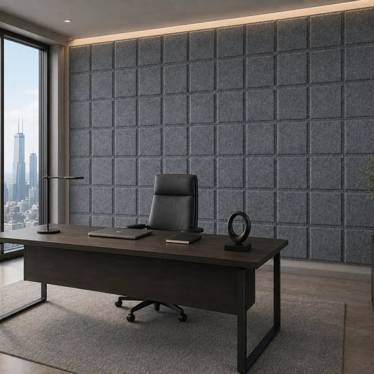 Angled view of an executive office with grey Square Bold 3D acoustic felt panels and floor-to-ceiling city windows