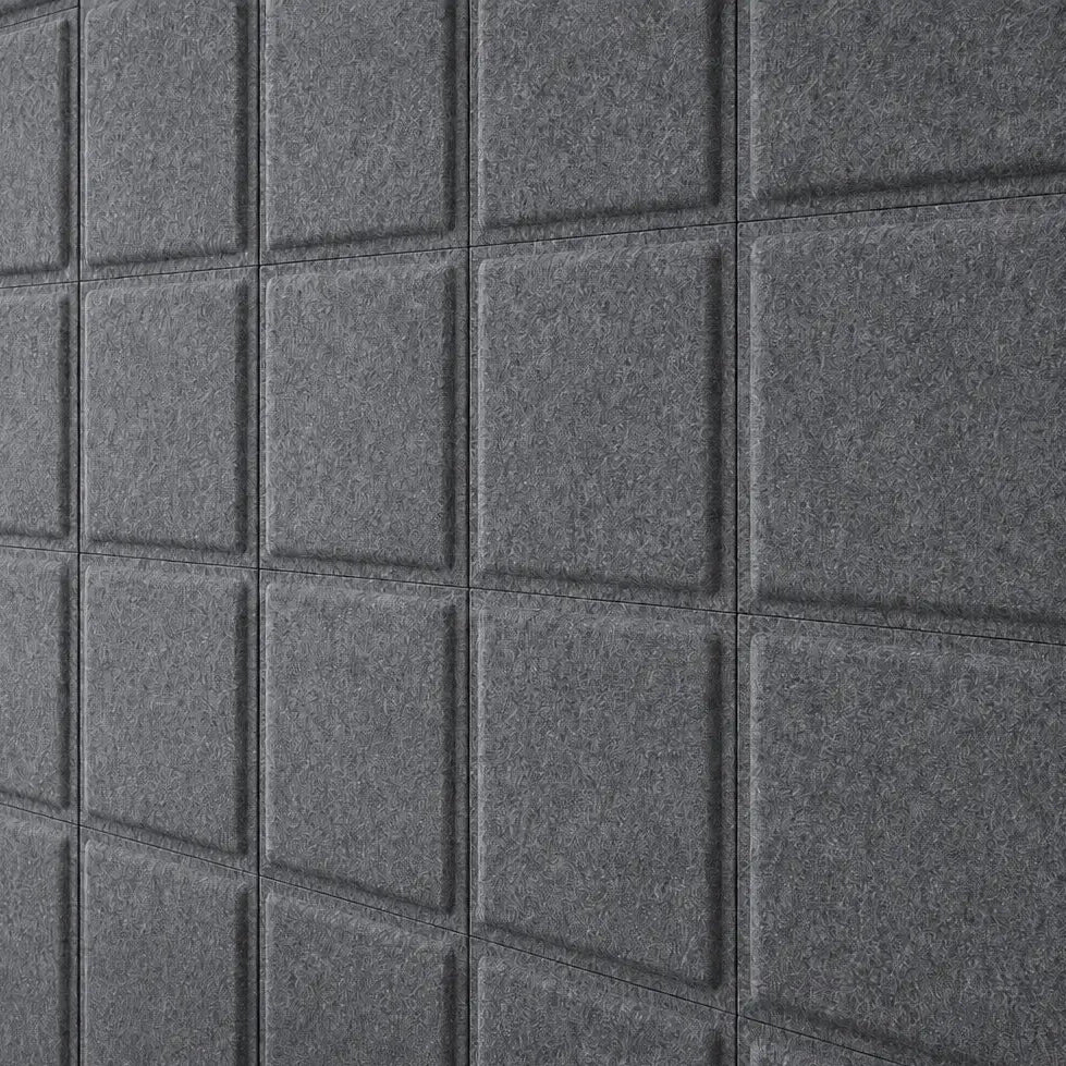 Close-up of grey Square Bold acoustic felt panels showing their textured surface and raised square design