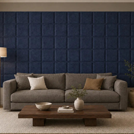 Front view of an elegant living room with navy Square Bold acoustic panels behind a dark taupe sofa
