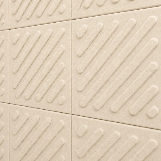 Close-up of cream acoustic felt wall panels highlighting the fibrous texture, raised relief and module connections
