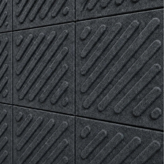 Close-up of grey acoustic felt wall panels highlighting the fibrous texture, raised relief and module connections