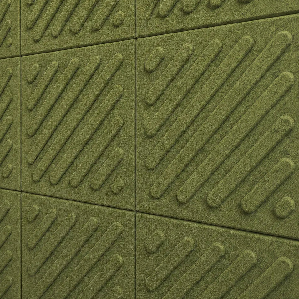 Close-up of olive green acoustic felt wall panels highlighting the fibrous texture, raised relief and module connections.
