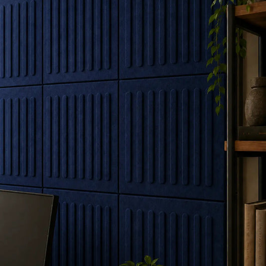 Close-up of navy blue acoustic felt wall panels showing their fibrous texture, panel joints and raised vertical relief