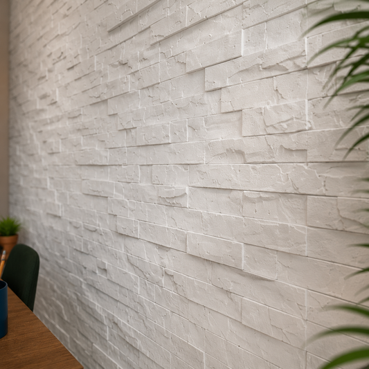Close-up angled view of white 3D polystyrene wall panels, highlighting their layered stacked-stone relief, rough texture, and natural depth variations
