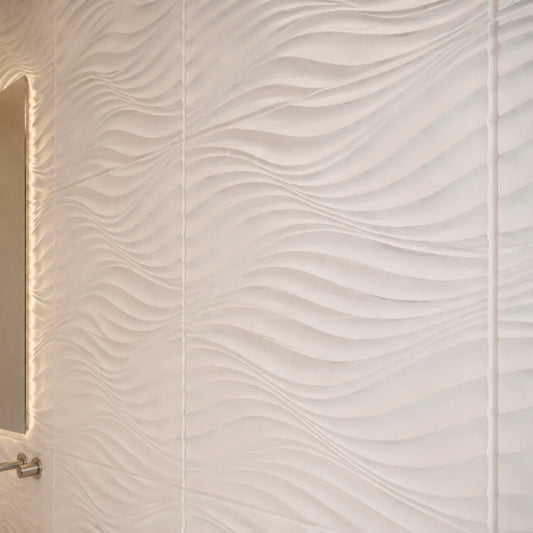 Close-up of white THE WIND polystyrene wall panels showing the flowing 3D relief and panel joints