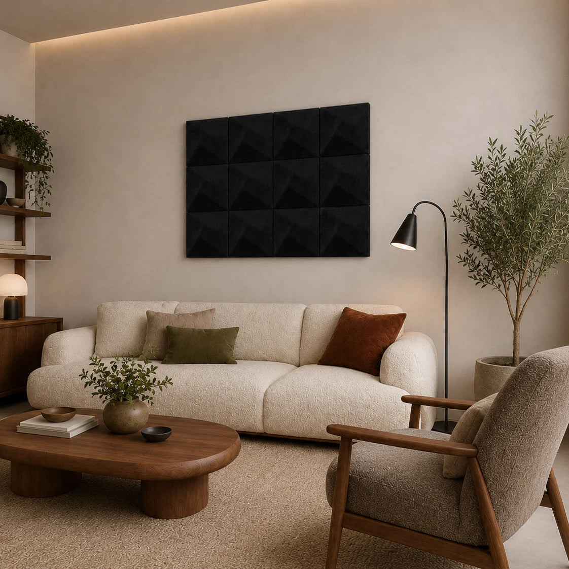 Angled living-room view featuring black square acoustic panels with a subtle geometric 3D relief