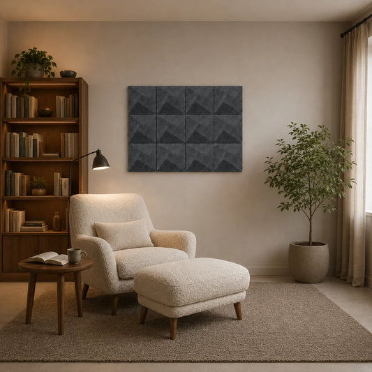 Grey square 3D acoustic felt panels displayed above a comfortable reading chair in a warm reading room