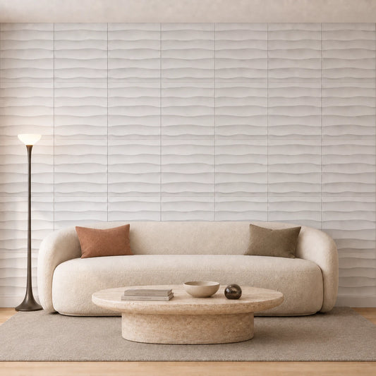 Front view of a minimalist neutral living room featuring a floor-to-ceiling wall of white 3D polystyrene panels with a horizontal wave pattern