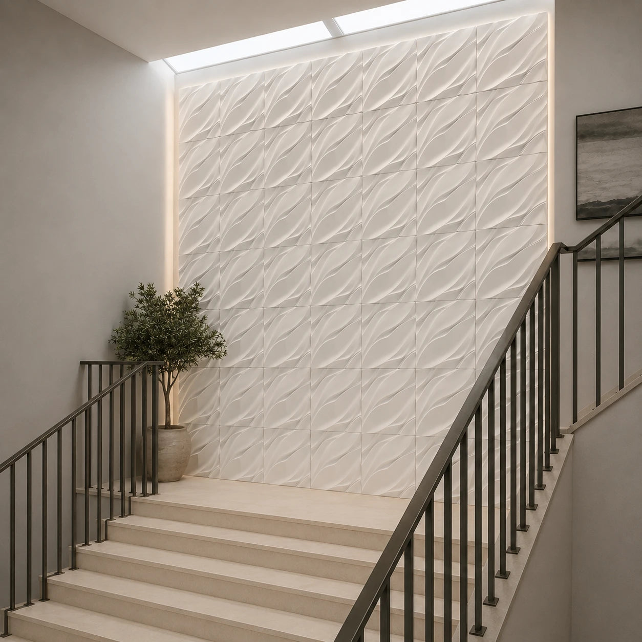 Modern staircase featuring a white accent wall covered with square WAVES gypsum 3D panels, viewed from the right