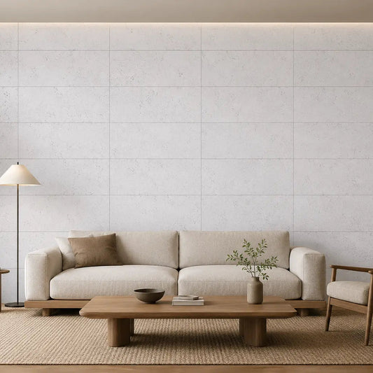 WHITE acoustic cork wall panels in a bright, minimalist living room with a cream sofa, wooden furniture and neutral décor front view