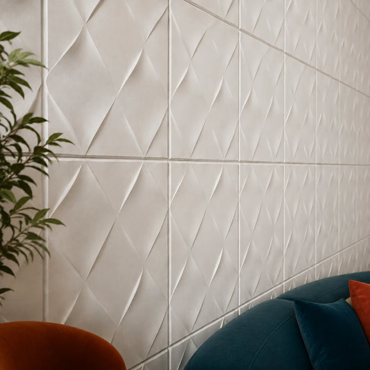 Close-up angled view of white WICKER gypsum 3D wall panels showing the raised geometric relief, panel joints and matte texture