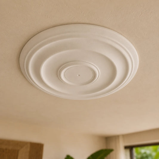 Close-up of the white Andrina ceiling rose with smooth stepped circular reliefs and a small central mounting point