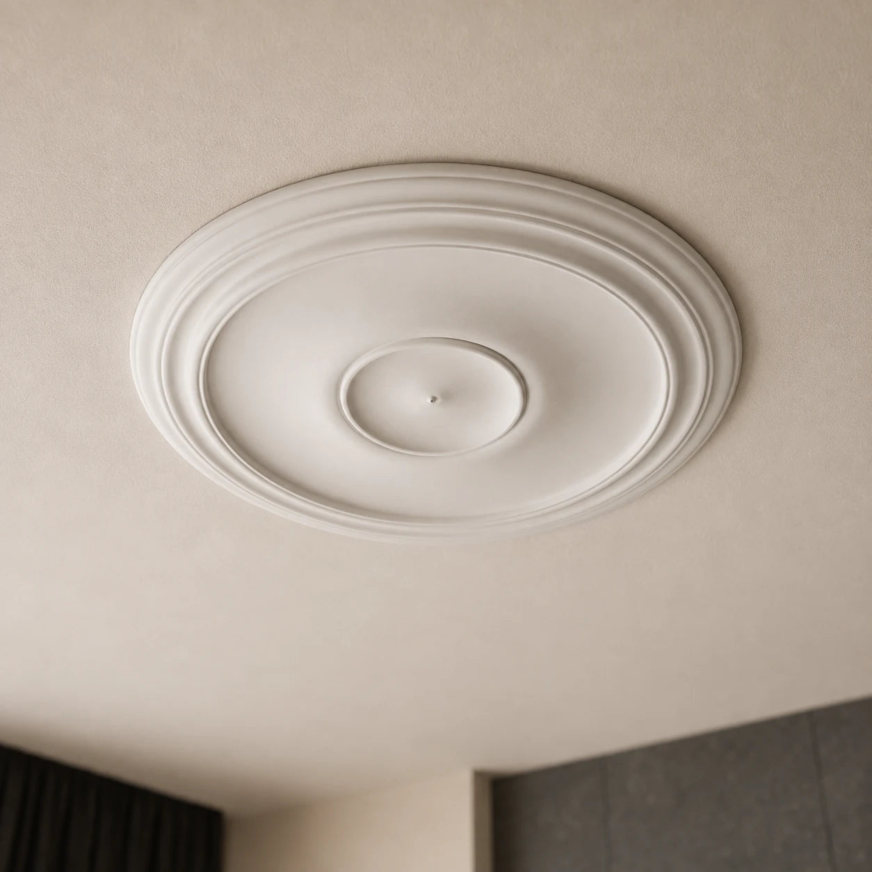 Close-up of the white Arabella ceiling rose with a wide smooth centre, raised circular border and central mounting point