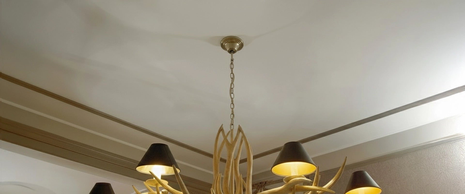 Before & After with Our ARSTYL® Ceiling Roses on grey ceiling with unique chandelier