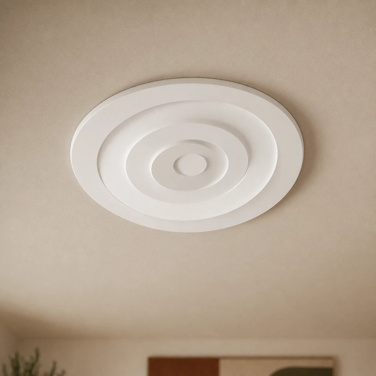 Close-up of the white CR5 Arstyl ceiling rose with deep, evenly spaced concentric circular reliefs